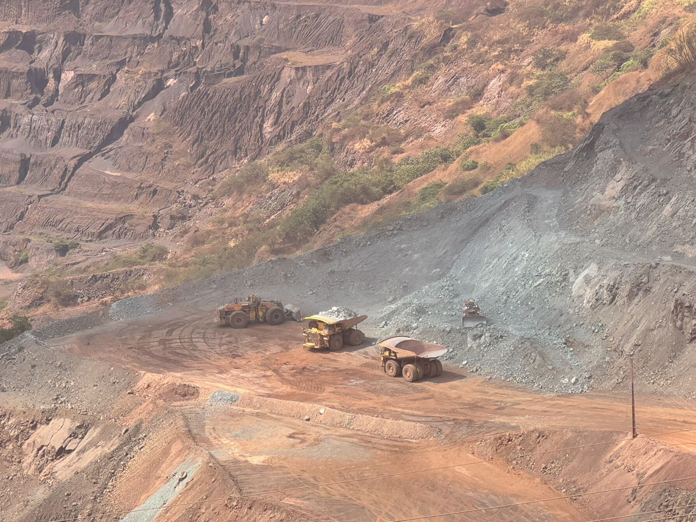 Haul trucks working in an open pit